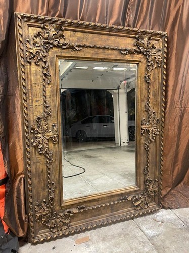 Large ornate wood - framed, wall